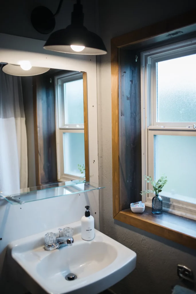 bathroom vanity and sink with window