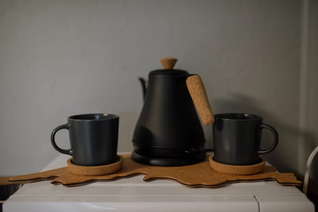 black coffee cups and kettle