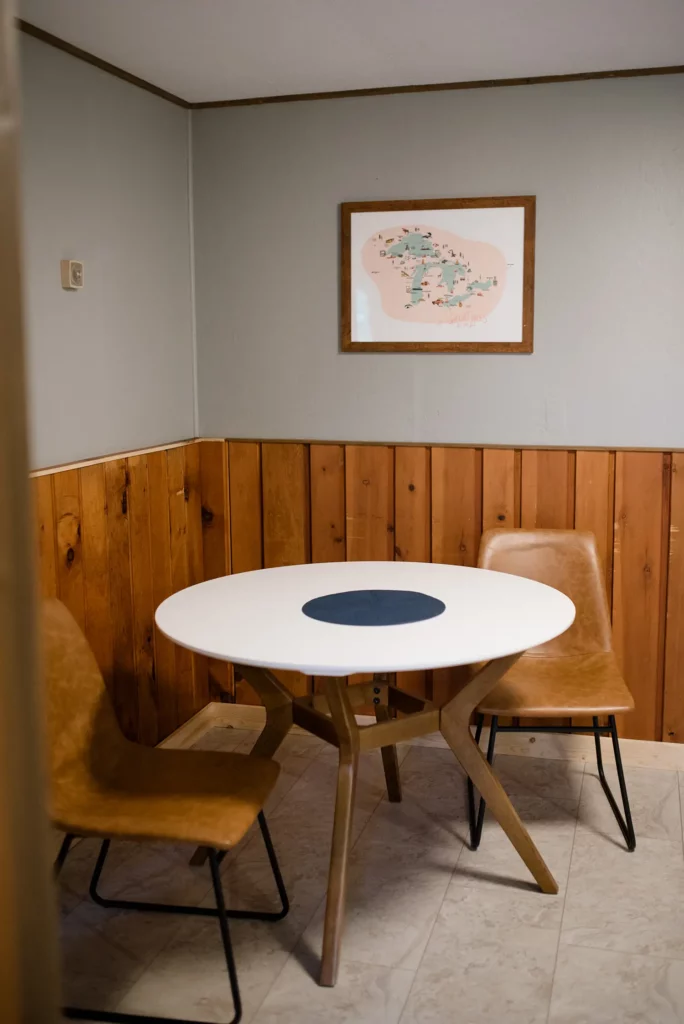 dining table in the corner with two chairs
