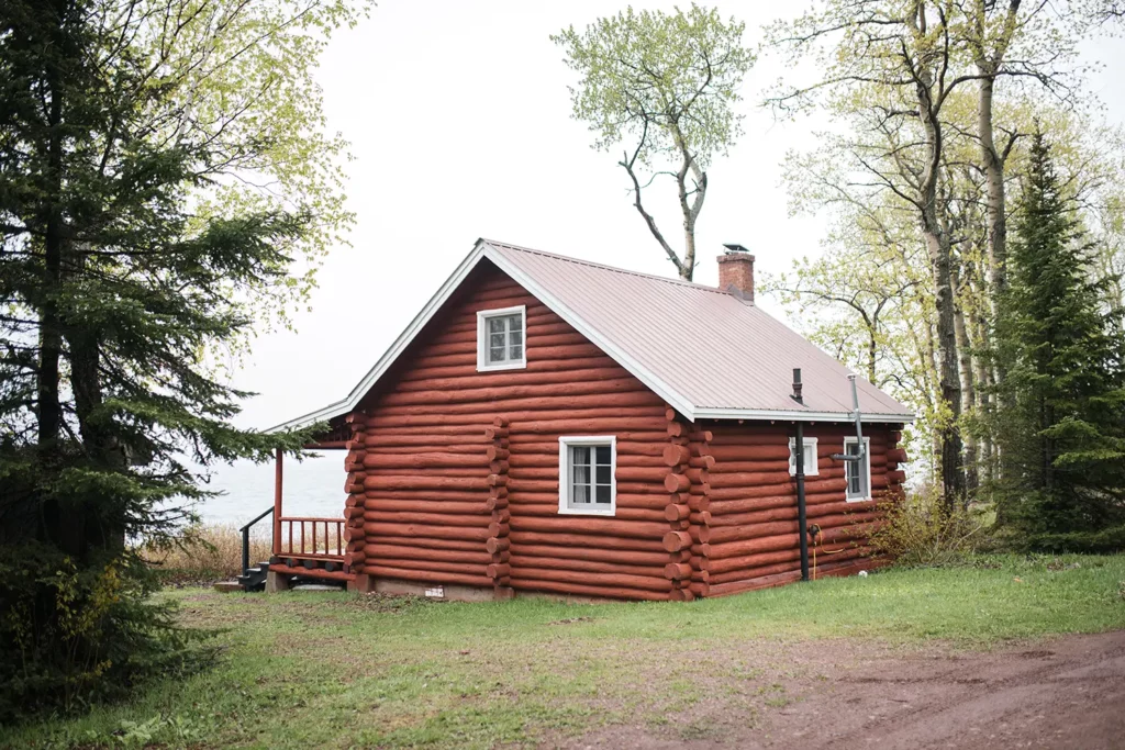 rear exterior view of log cabin overlooking Lake Superior