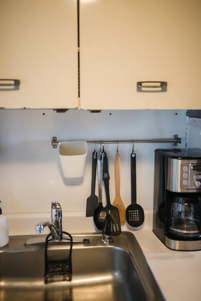 kitchen sink with cooking utensils